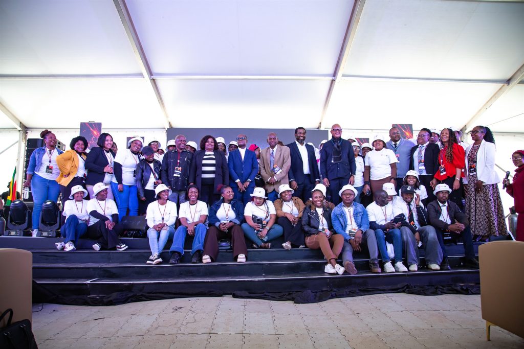 Participants gathered for a group photograph on stage at the To The Power of X² North West launch in Mahikeng.
