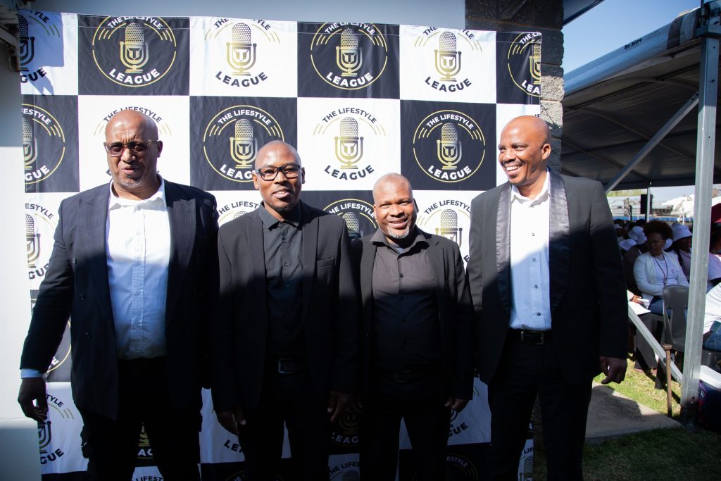 Guests photographed at the event media backdrop during the To The Power of X² North West launch in Mahikeng.