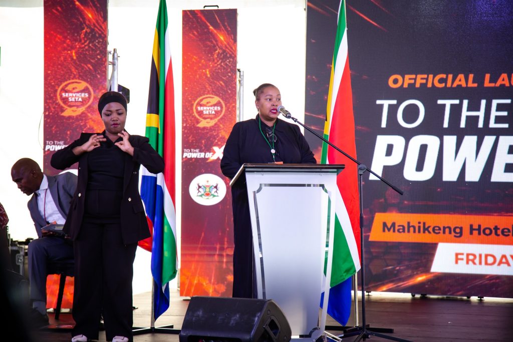 Speaker and sign-language interpreter during the To The Power of X² North West launch in Mahikeng.