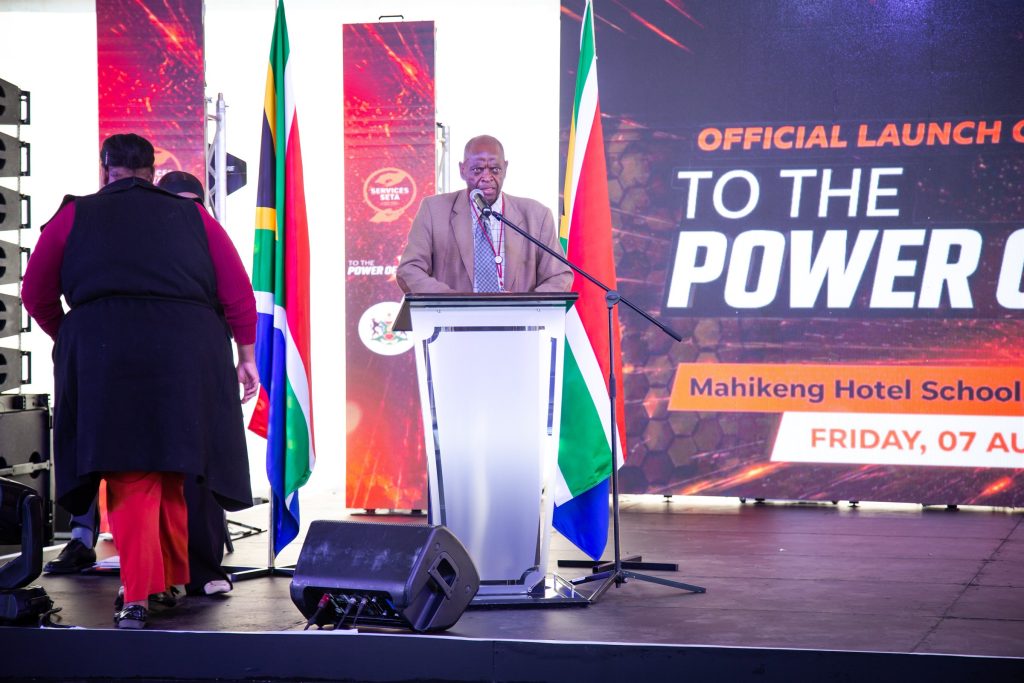 Speaker addressing attendees at the To The Power of X² North West launch in Mahikeng.